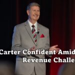 Carter Confident Amid Revenue Challenges.